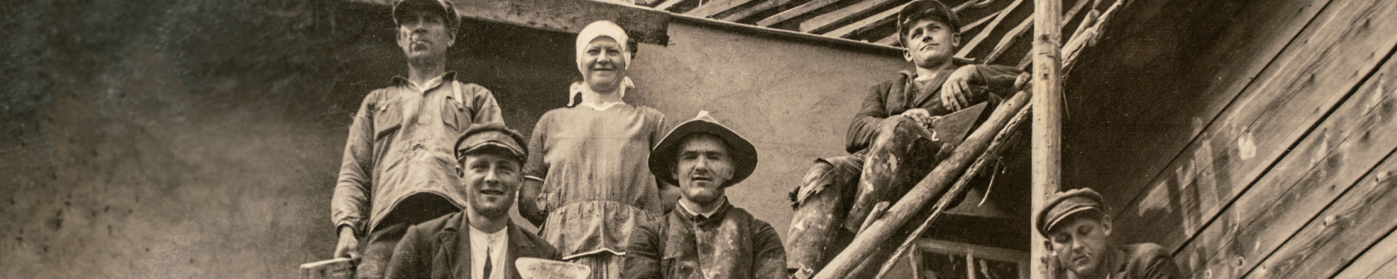 Latvia - CIRCA 1920s: Photo of builders working on site. Sitting on scaffolding